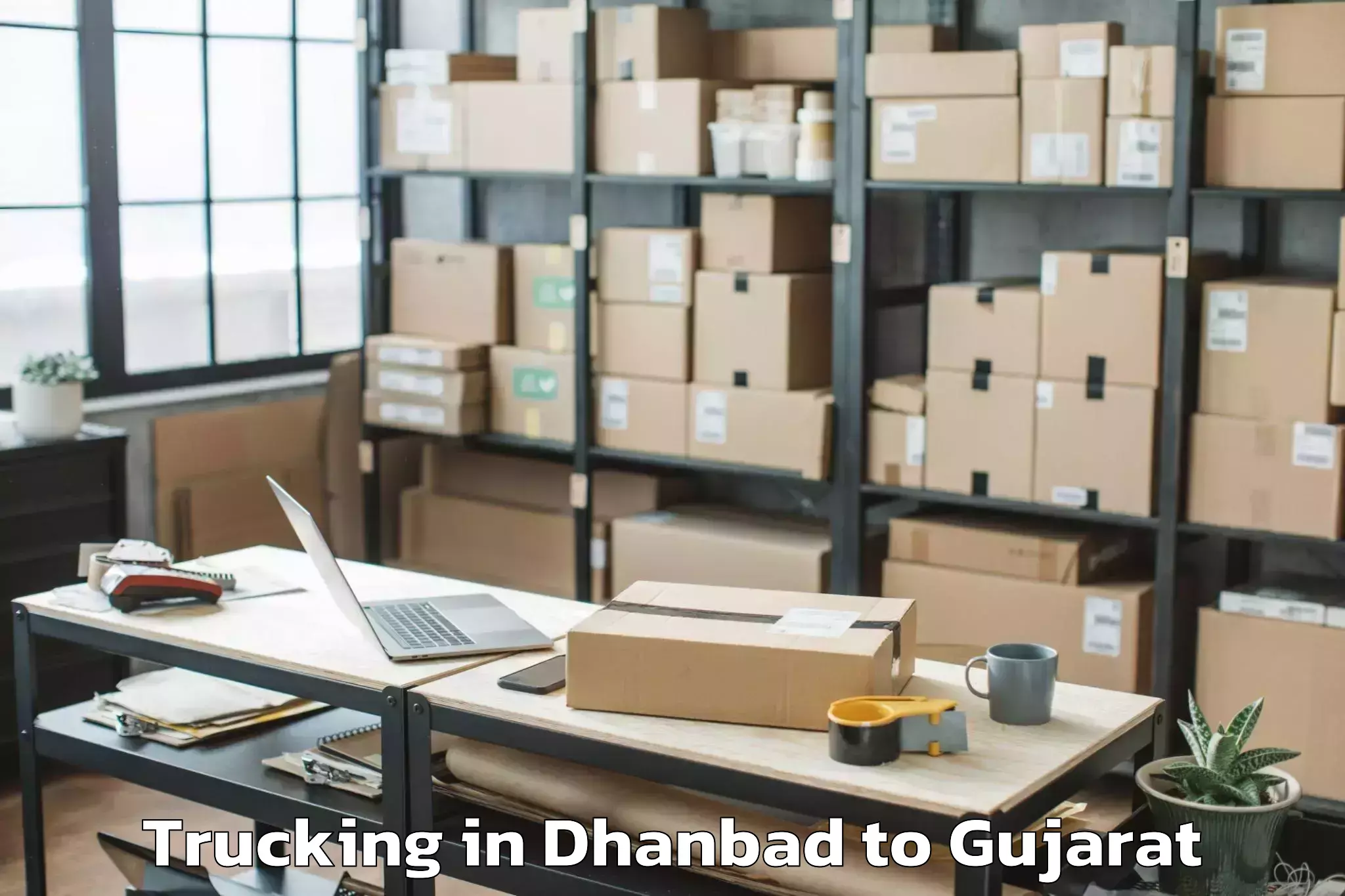 Reliable Dhanbad to Lodhika Trucking